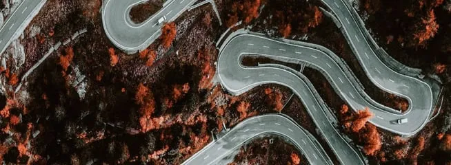 From Up Above VR experience showcasing winding road from aerial view